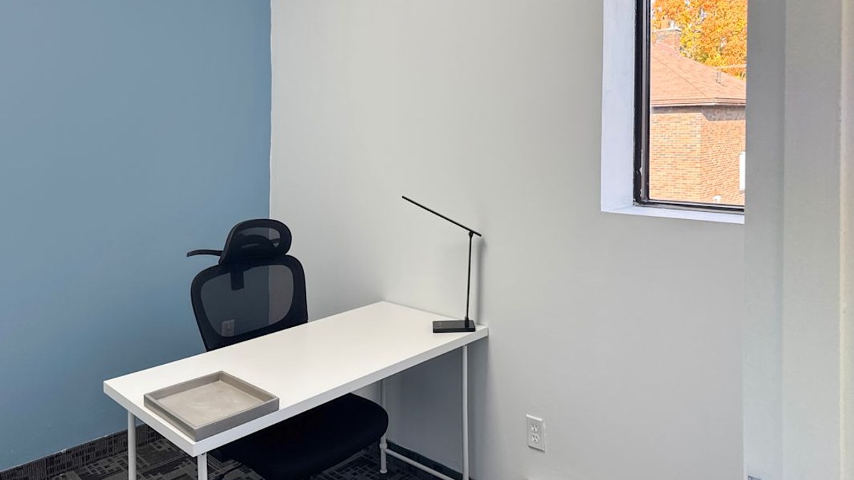 Furnished one person private office with a window at 111 Simcoe Street N in downtown Oshawa